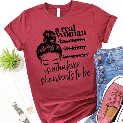 A real woman is.. Whatever she wants to be T-shirt! - image1